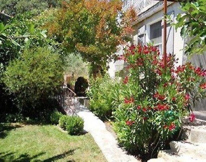 A village house of 150m2 divided into 2 properties with landscaped garden o