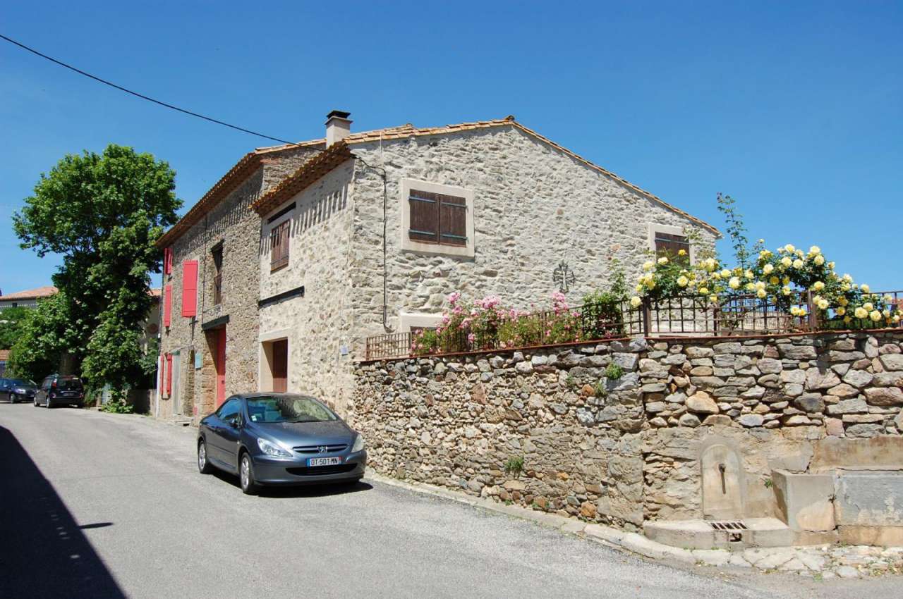 Pretty stone village property with a swimming pool and garden in the Minerv