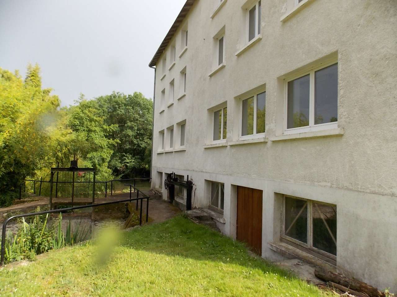 Spacious former water mill, with a river running alongside and with lovely