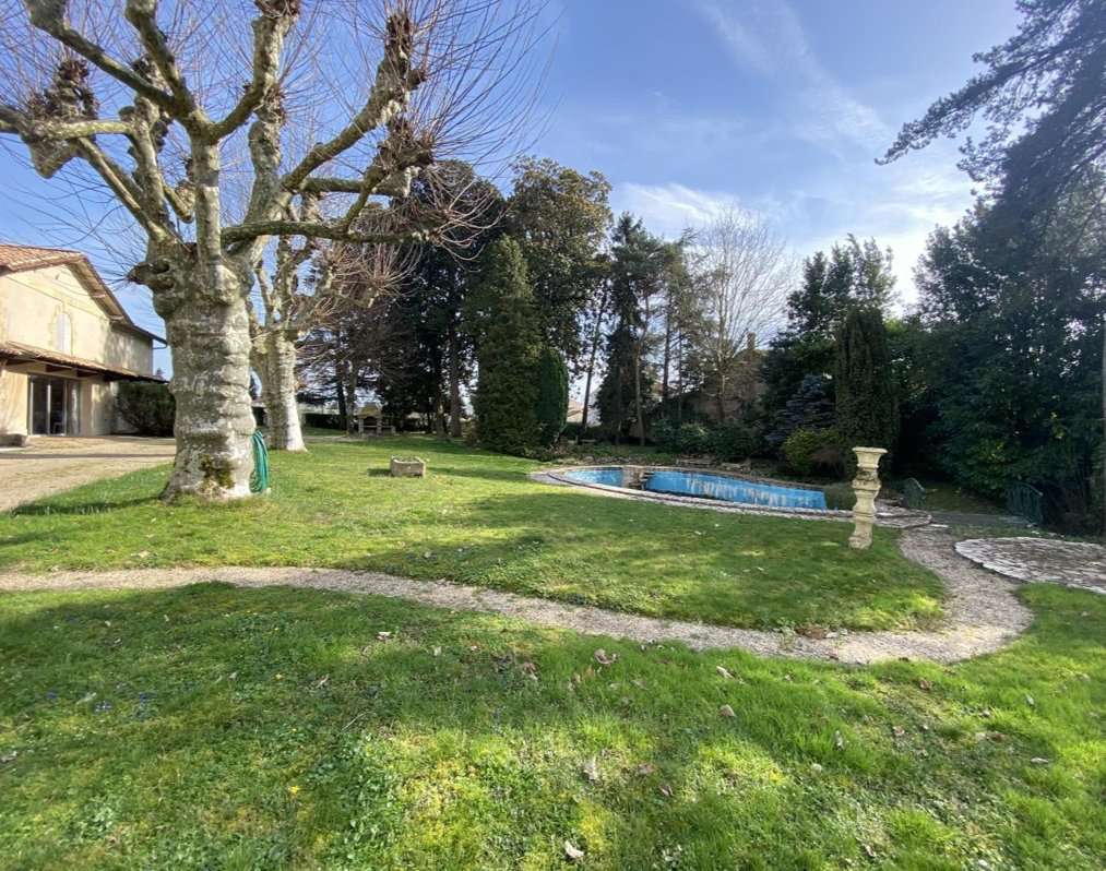 Nestling in half an acre of beautiful landscaped gardens is this wonderful