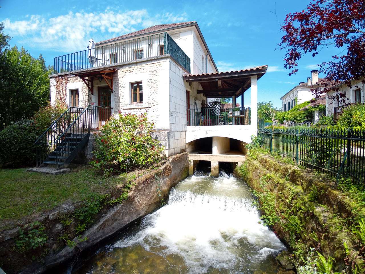 Beautiful 16th century water mill with various surrounding buildings and ex