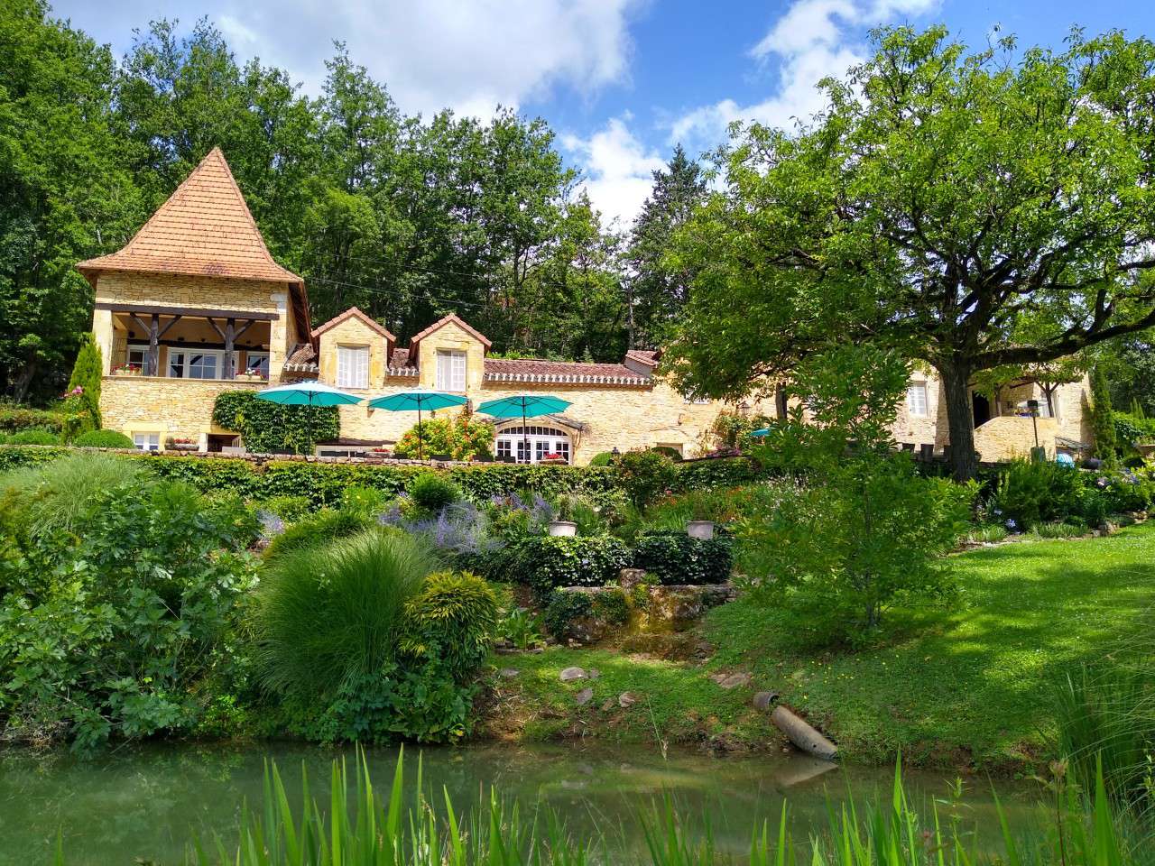 Nestling in nearly 10 acres of glorious landscaped gardens with trees and p