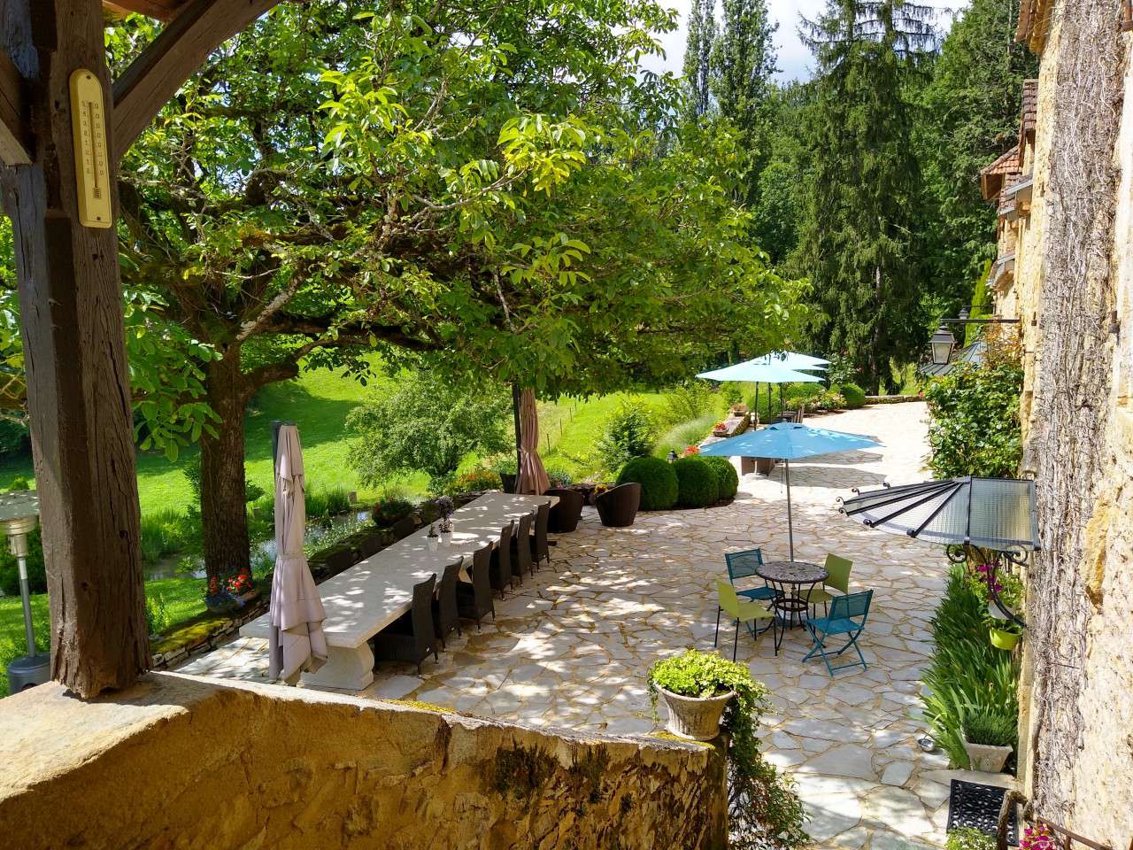 Nestling in nearly 10 acres of glorious landscaped gardens with trees and p