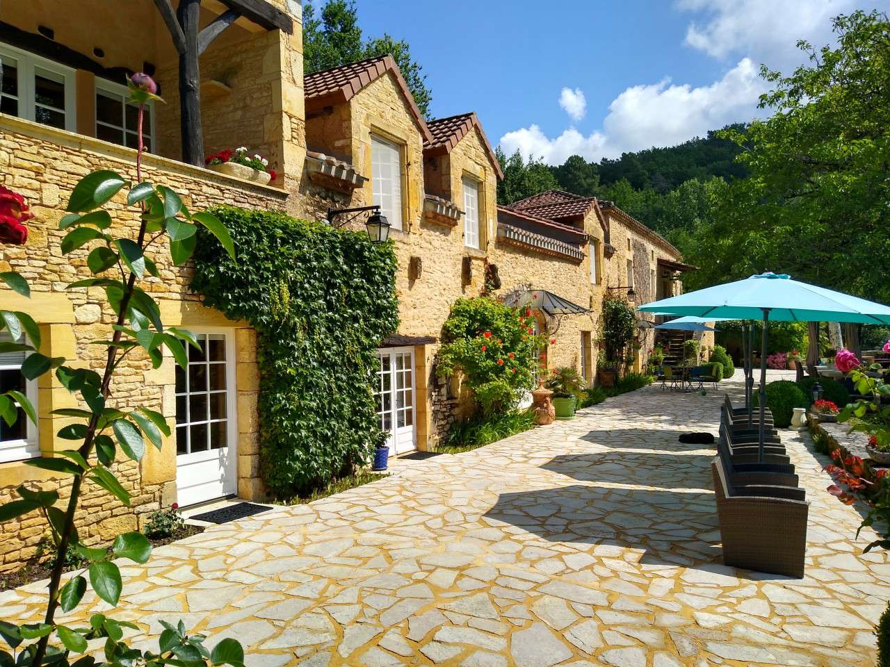 Nestling in nearly 10 acres of glorious landscaped gardens with trees and p