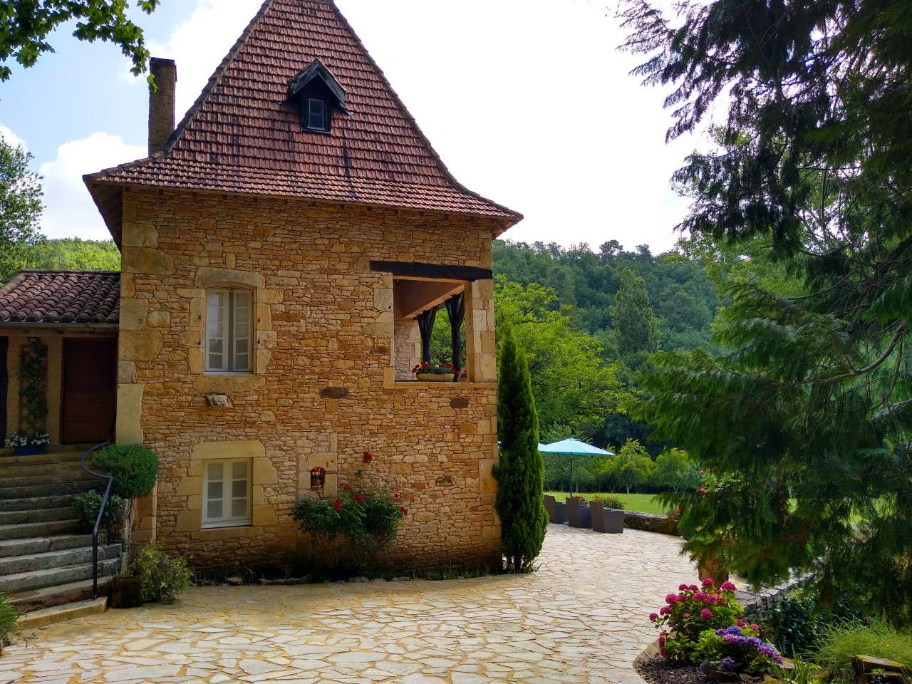 Nestling in nearly 10 acres of glorious landscaped gardens with trees and p