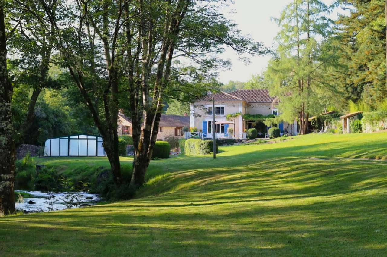 Delightful renovated rural property set in 15 acres with a river, pool, mai