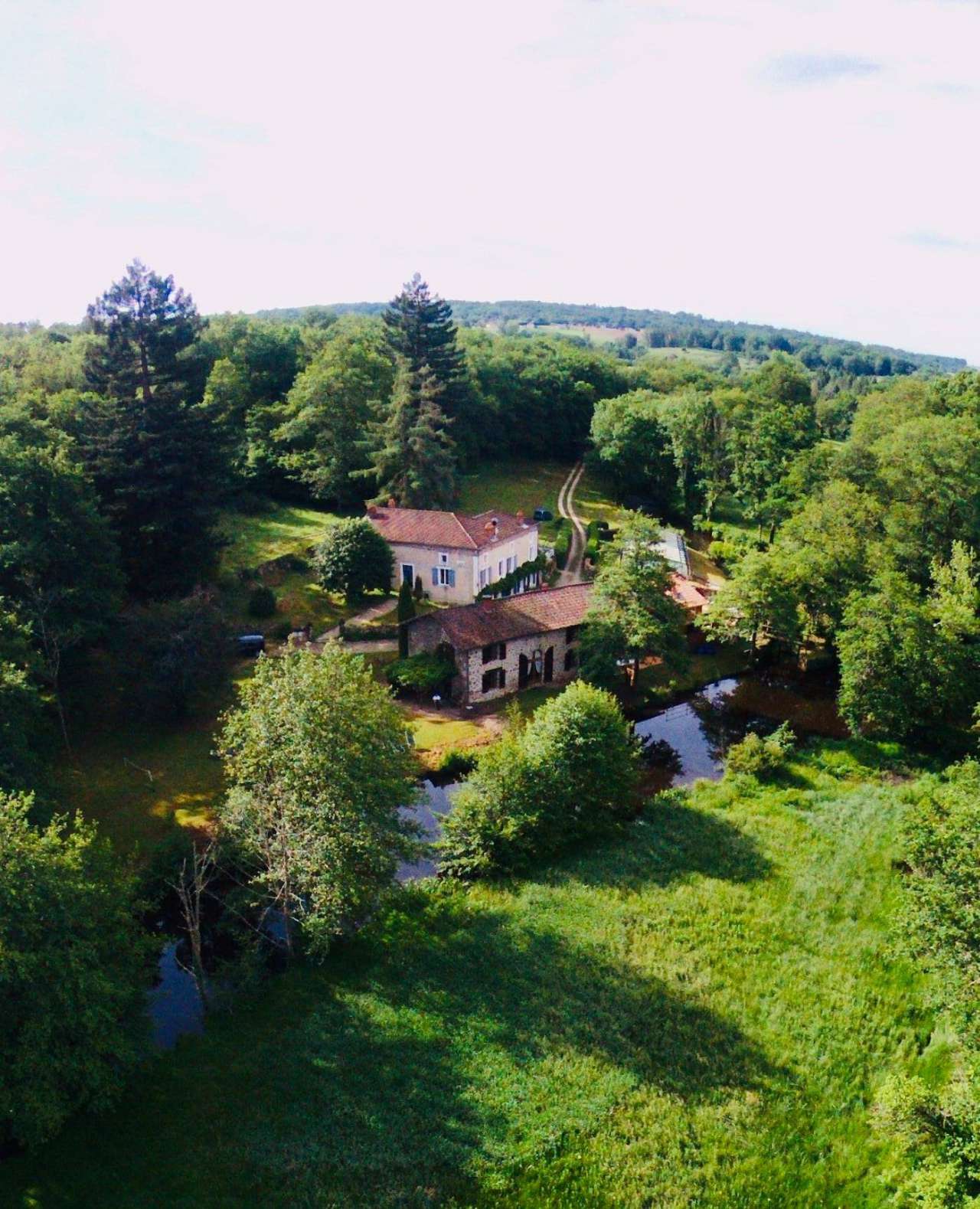Delightful renovated rural property set in 15 acres with a river, pool, mai