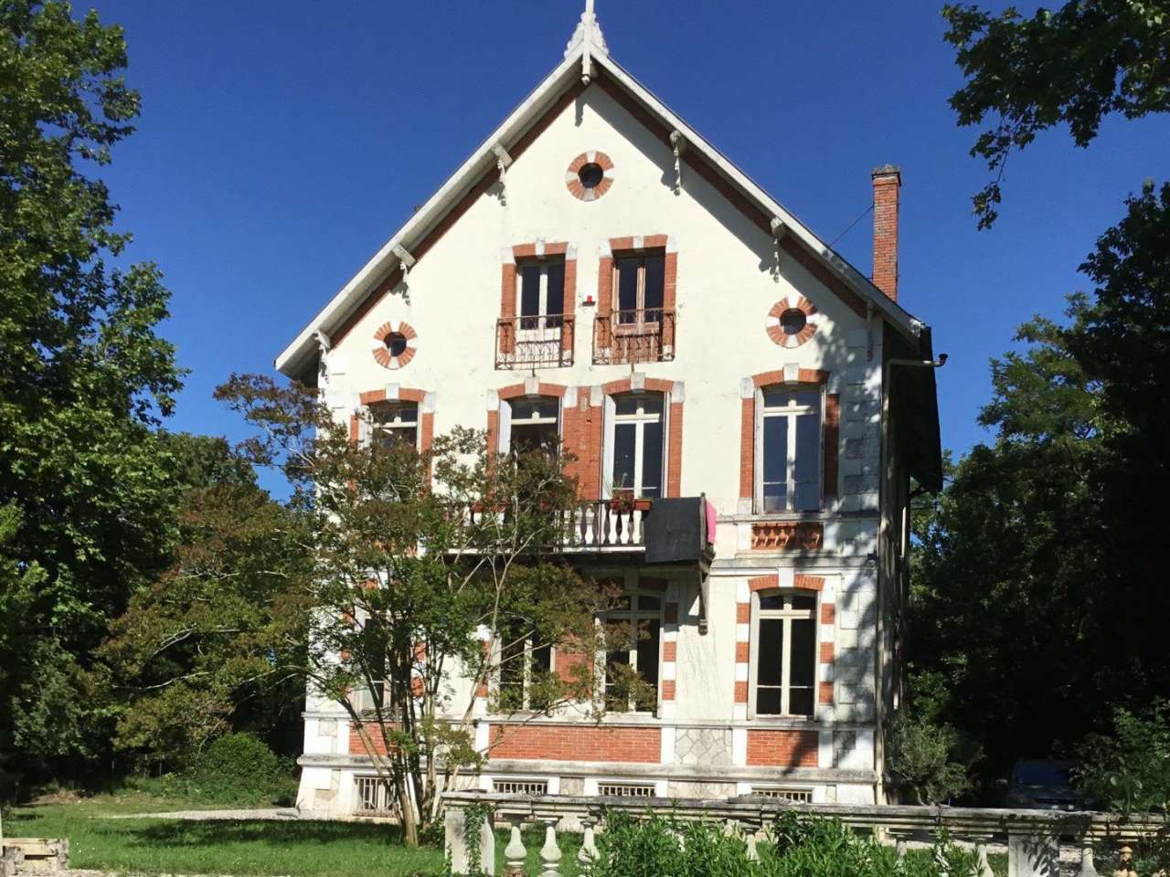 Nestling in over 6 acres of glorious landscaped gardens with pool, woodland