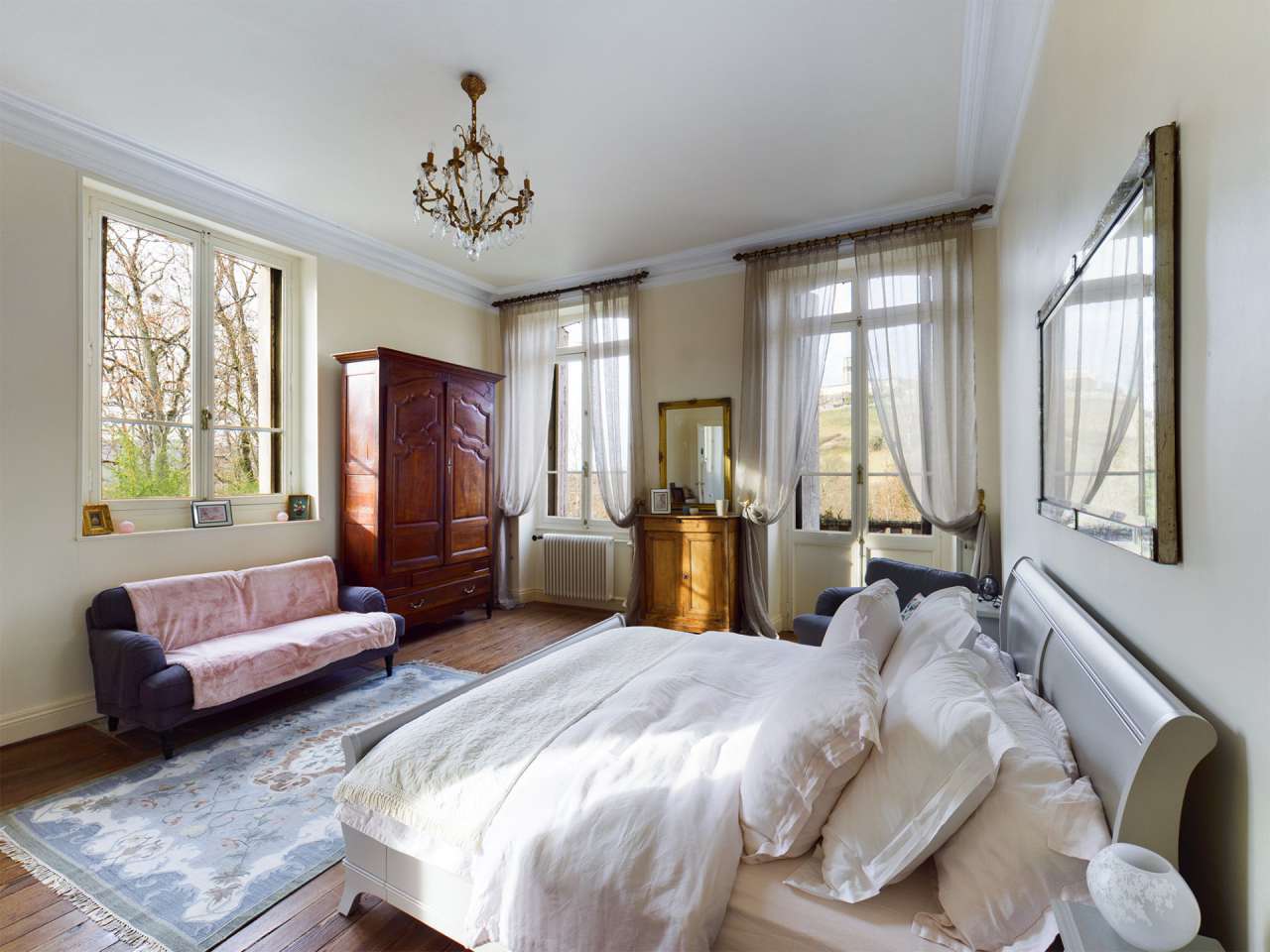 Nestling in over 6 acres of glorious landscaped gardens with pool, woodland