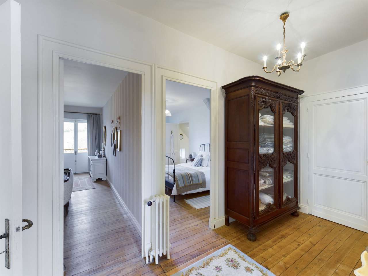 Nestling in over 6 acres of glorious landscaped gardens with pool, woodland