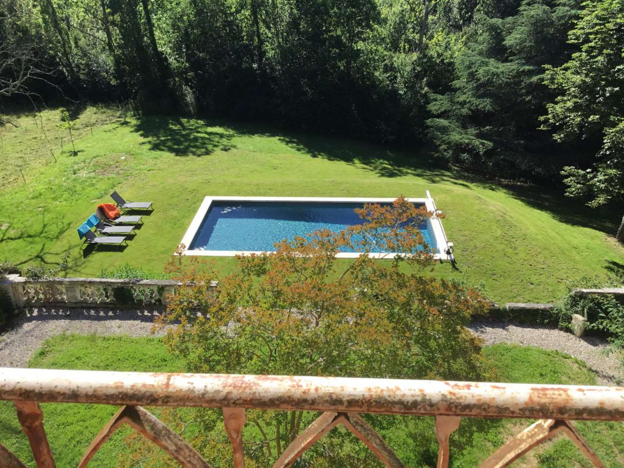 Nestling in over 6 acres of glorious landscaped gardens with pool, woodland