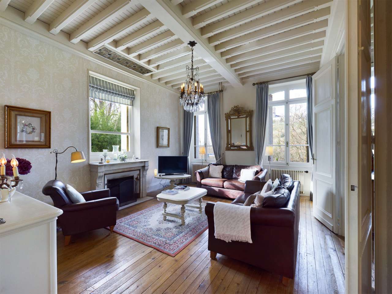 Nestling in over 6 acres of glorious landscaped gardens with pool, woodland