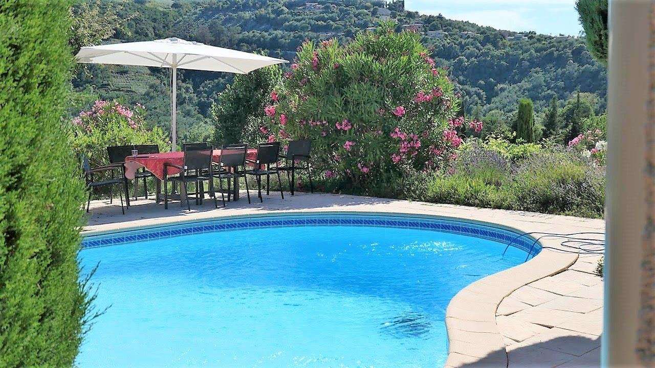 Nestling in beautiful landscaped gardens with pool, is this superb 5 bedroo