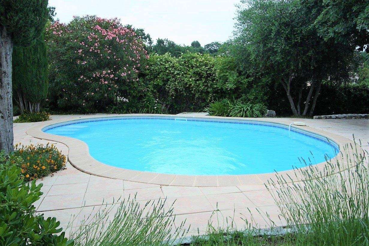 Nestling in beautiful landscaped gardens with pool, is this superb 5 bedroo