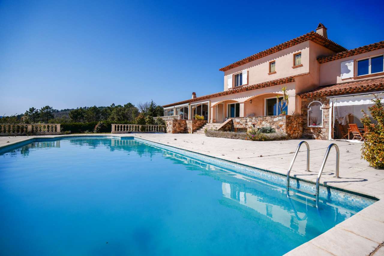 Nestling in over 5.5 acres of glorious landscaped gardens with expansive po