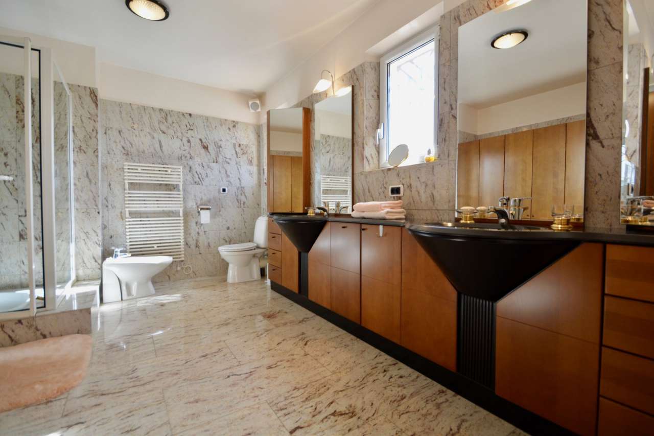 Nestling in over 5.5 acres of glorious landscaped gardens with expansive po