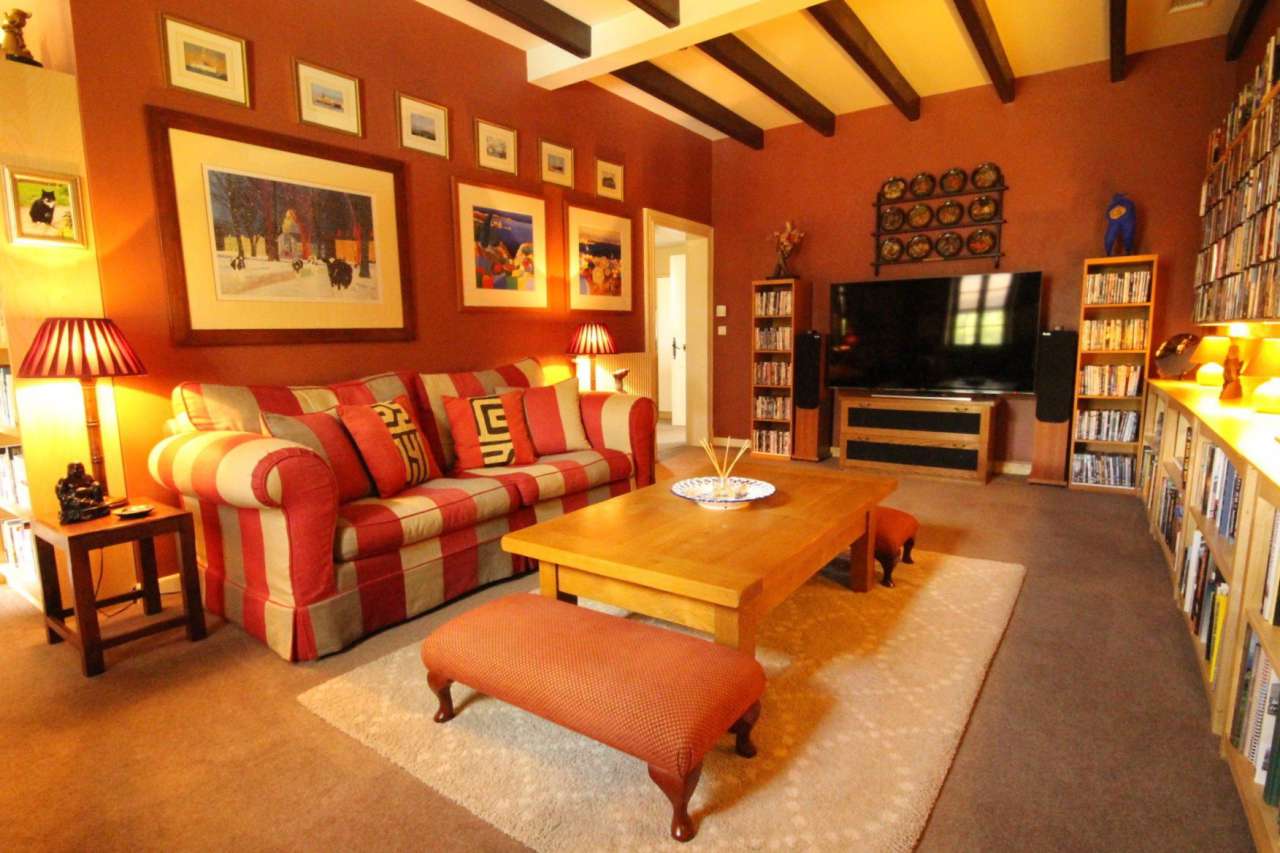 Surrounded by over 8 acres of glorious land with beautiful gardens, pond an