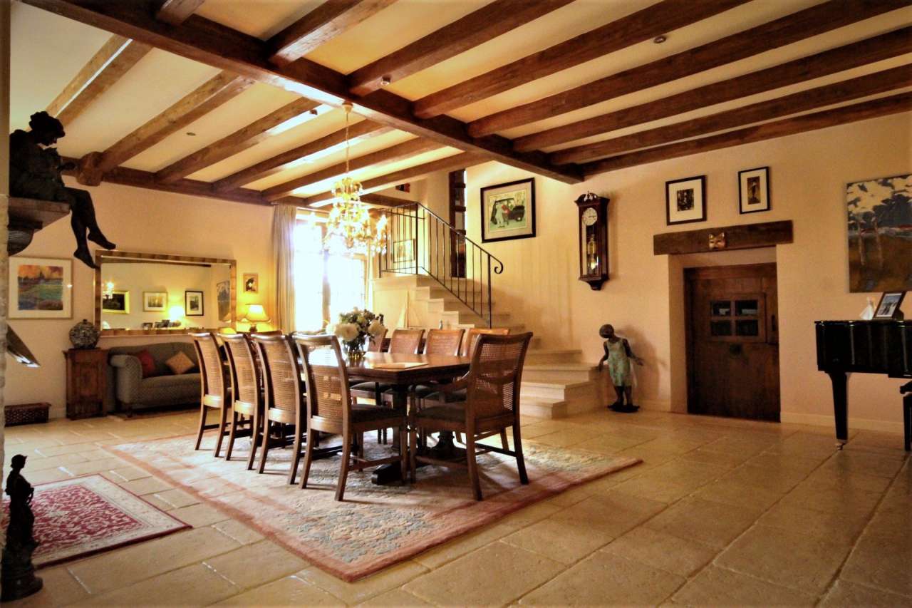 Surrounded by over 8 acres of glorious land with beautiful gardens, pond an