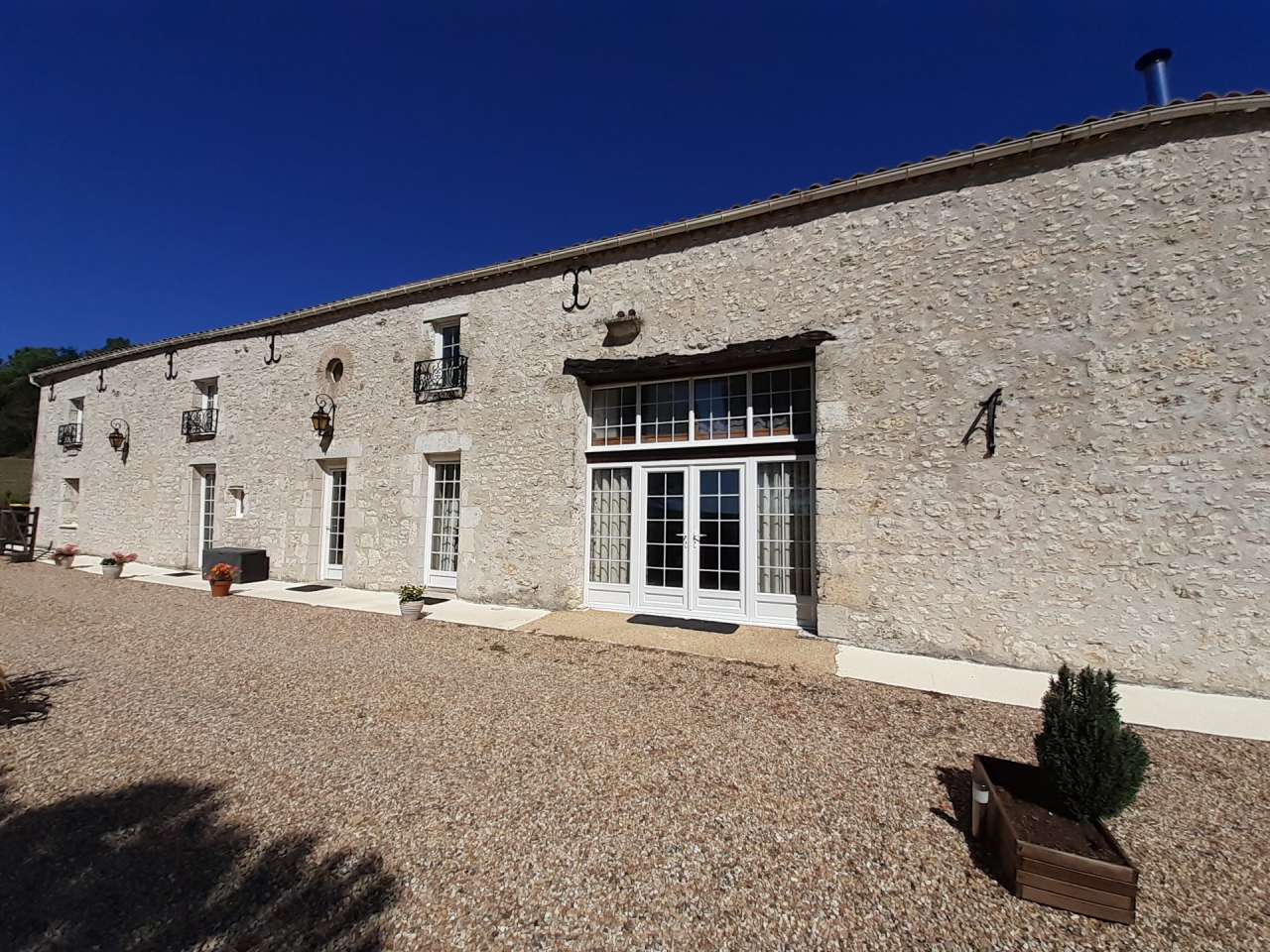 Situated in a quiet and private setting, this superb stone built farmhouse