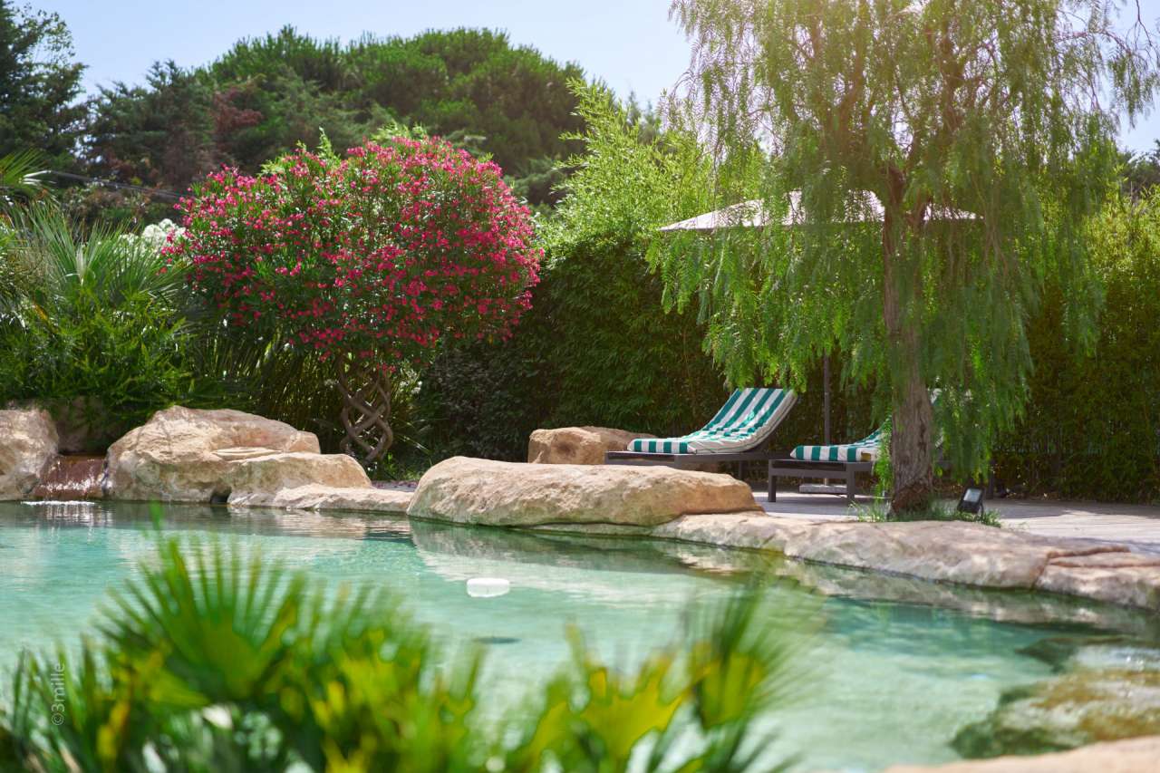 Nestling in over 2 acres of glorious landscaped gardens with pool and viney