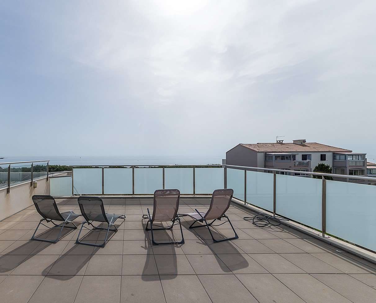 Enjoying panoramic sea views from the roof terrace of its idyllic location
