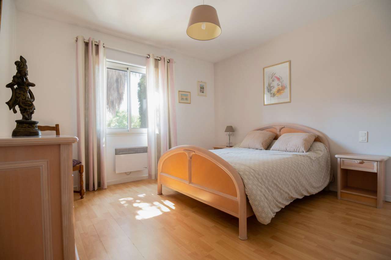 Nestling in 13.5 acres of beautiful landscaped gardens with expansive pool,