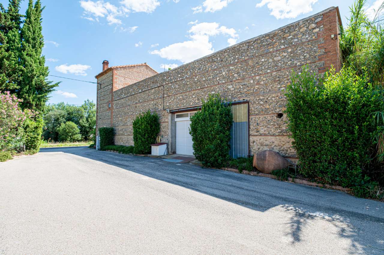 Nestling in 13.5 acres of beautiful landscaped gardens with expansive pool,