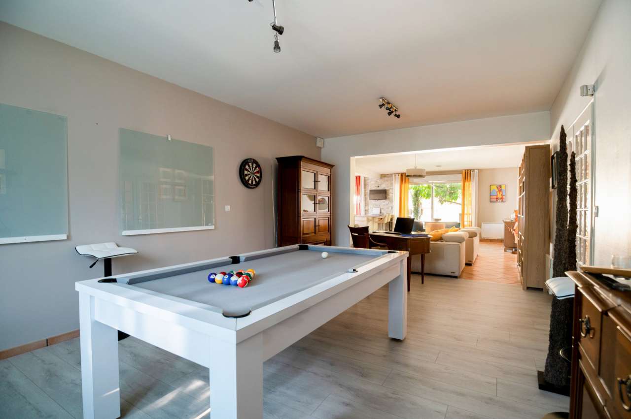 Nestling in 13.5 acres of beautiful landscaped gardens with expansive pool,