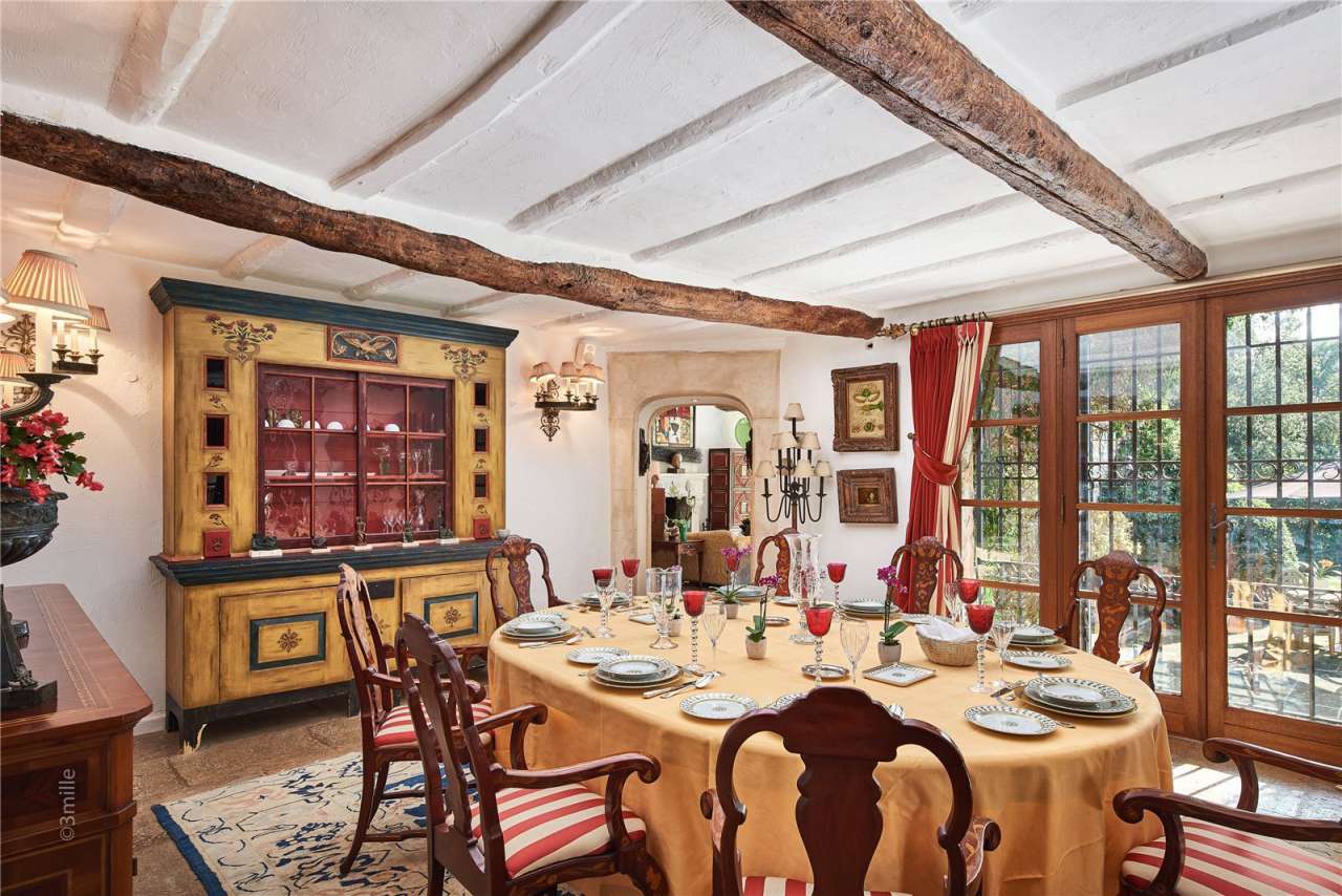 Surrounded by 1.5 acres of glorious landscaped gardens with expansive pool