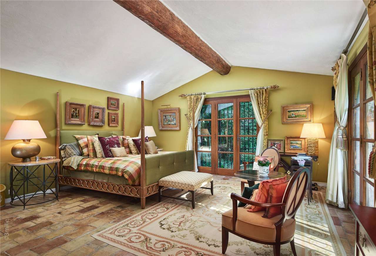 Surrounded by 1.5 acres of glorious landscaped gardens with expansive pool