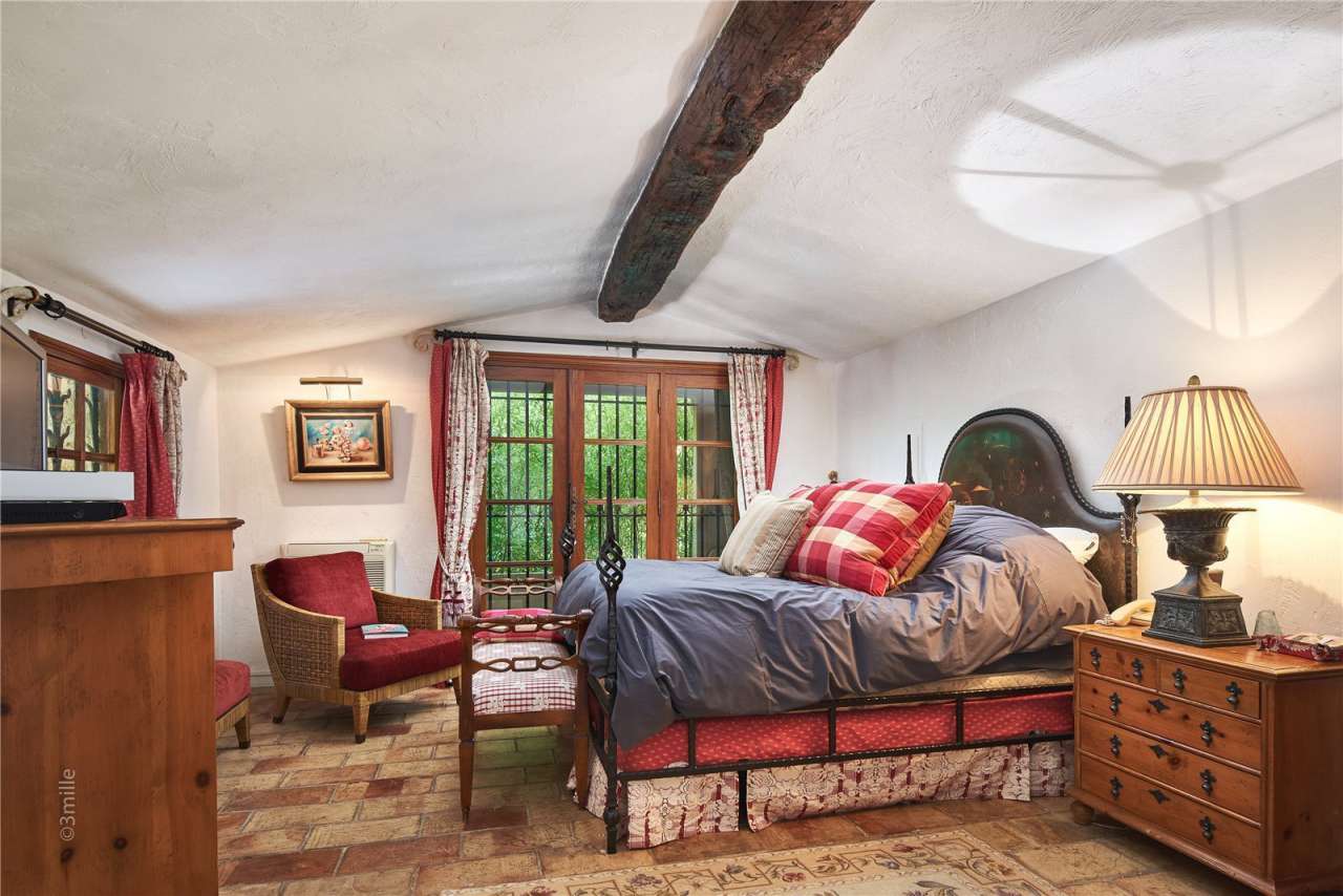 Surrounded by 1.5 acres of glorious landscaped gardens with expansive pool