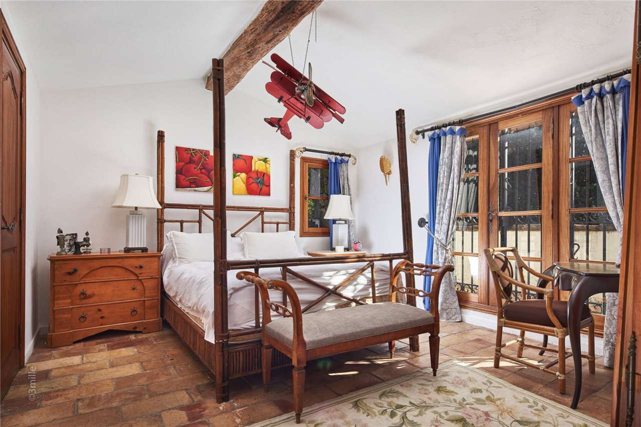 Surrounded by 1.5 acres of glorious landscaped gardens with expansive pool