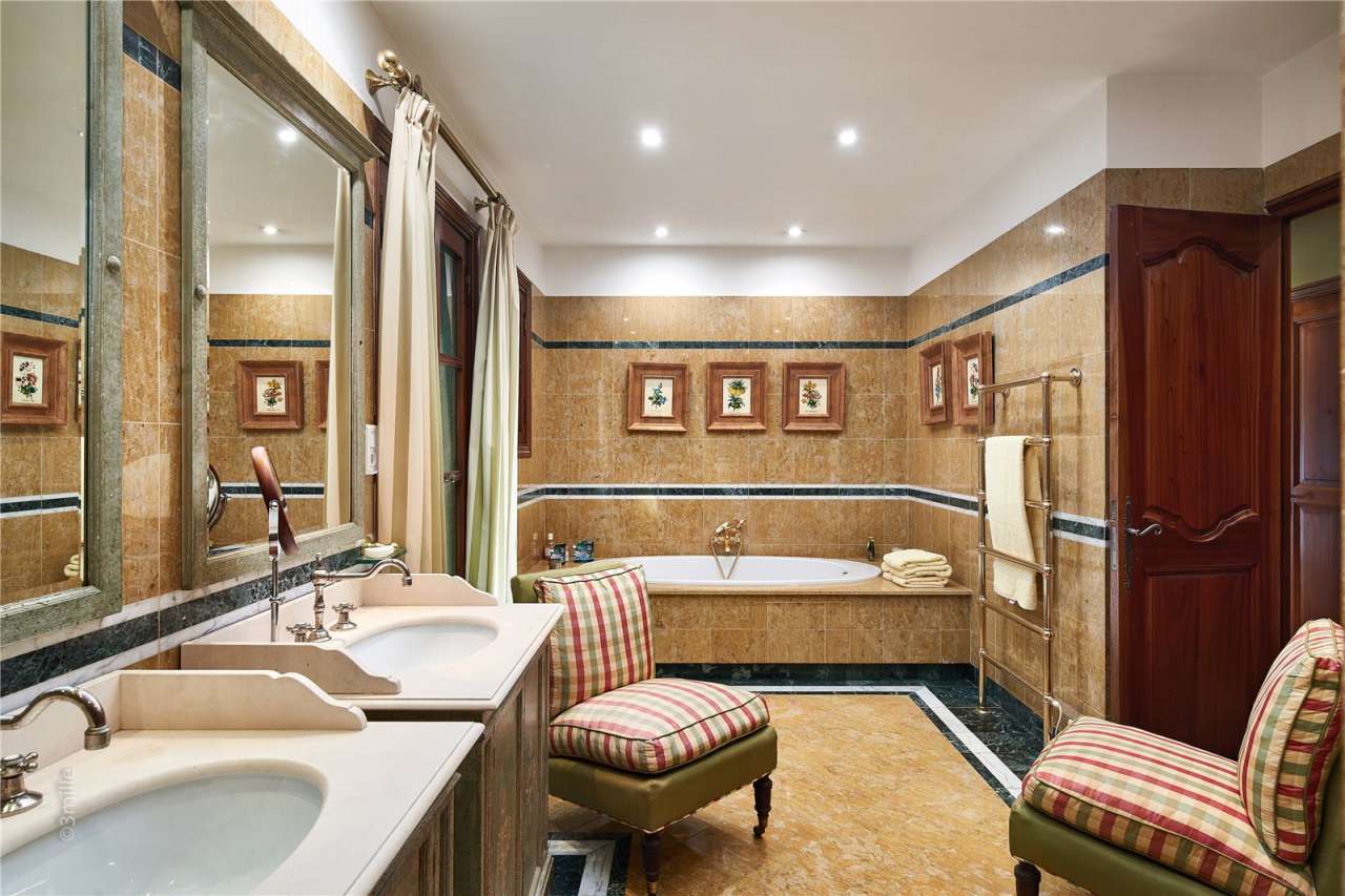 Surrounded by 1.5 acres of glorious landscaped gardens with expansive pool