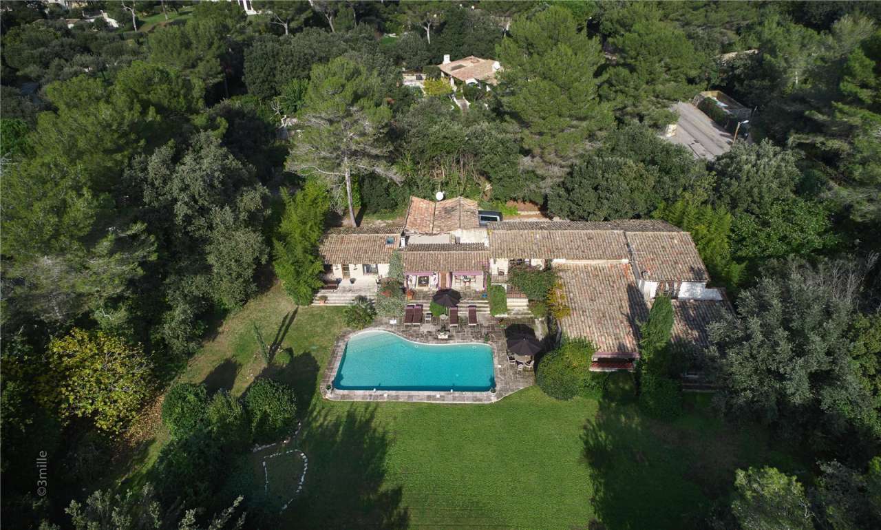 Surrounded by 1.5 acres of glorious landscaped gardens with expansive pool