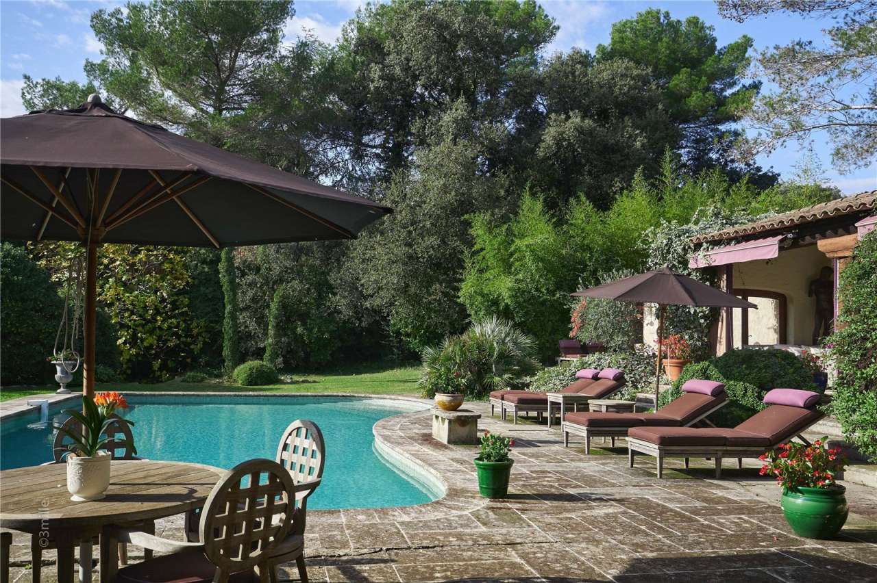 Surrounded by 1.5 acres of glorious landscaped gardens with expansive pool