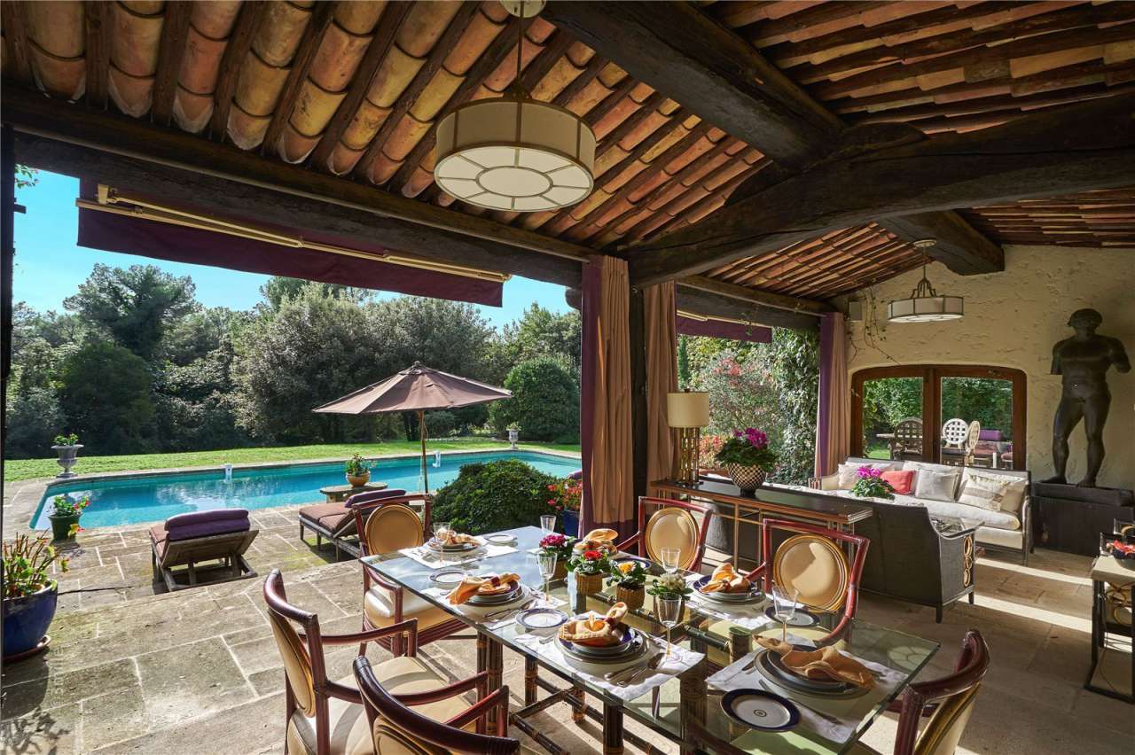 Surrounded by 1.5 acres of glorious landscaped gardens with expansive pool