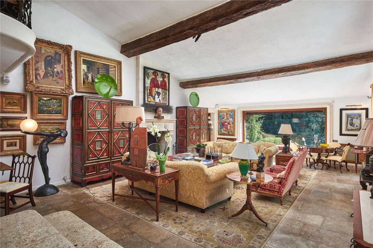 Surrounded by 1.5 acres of glorious landscaped gardens with expansive pool