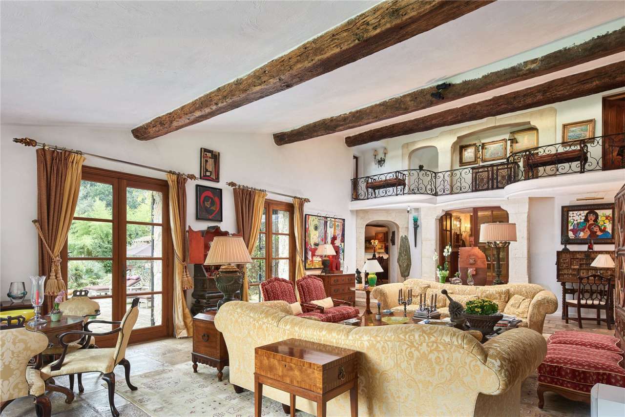 Surrounded by 1.5 acres of glorious landscaped gardens with expansive pool