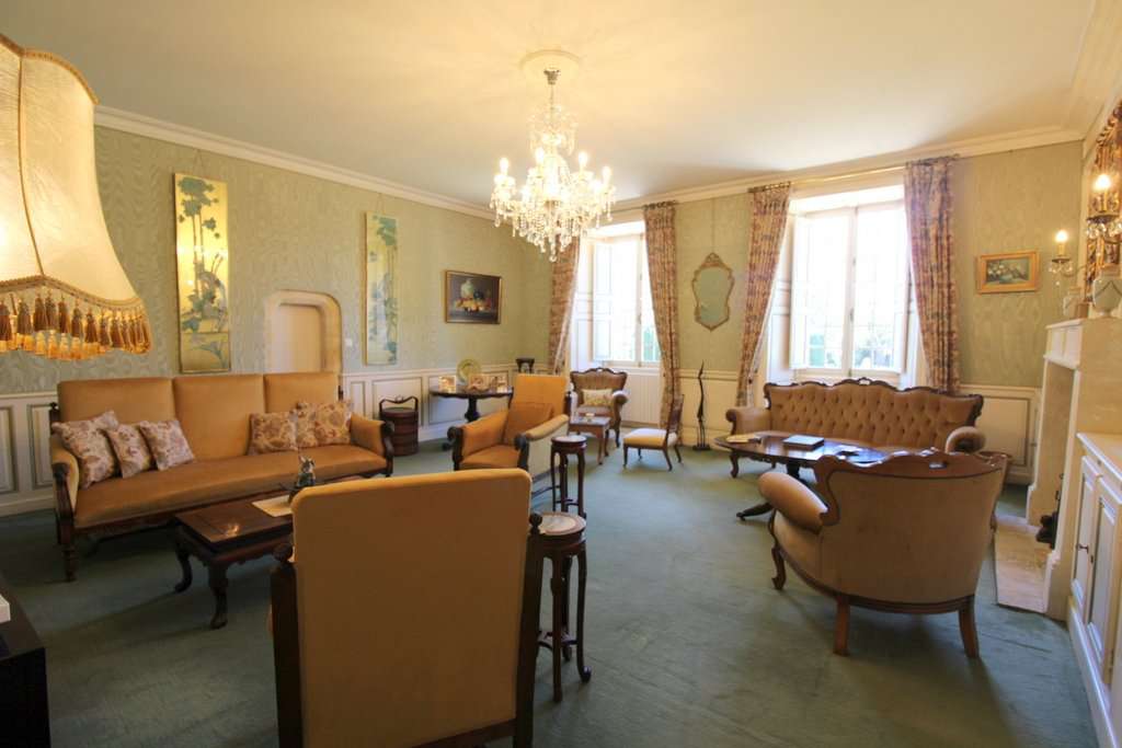 Set within mature landscaped gardens of 7,542m2 with a swimming pool and wi