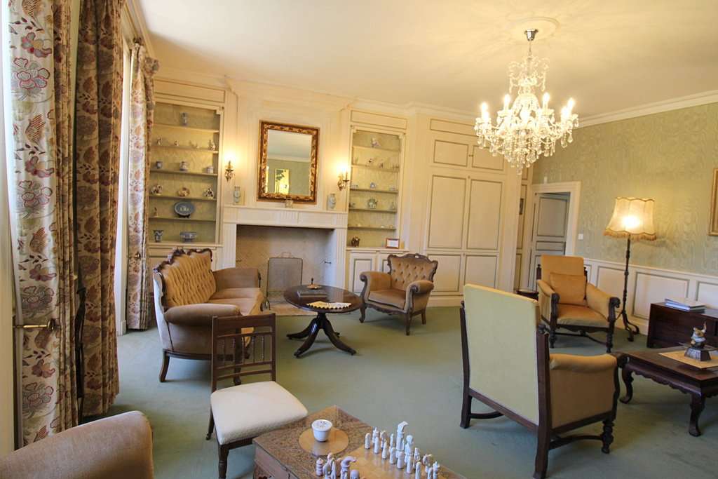 Set within mature landscaped gardens of 7,542m2 with a swimming pool and wi