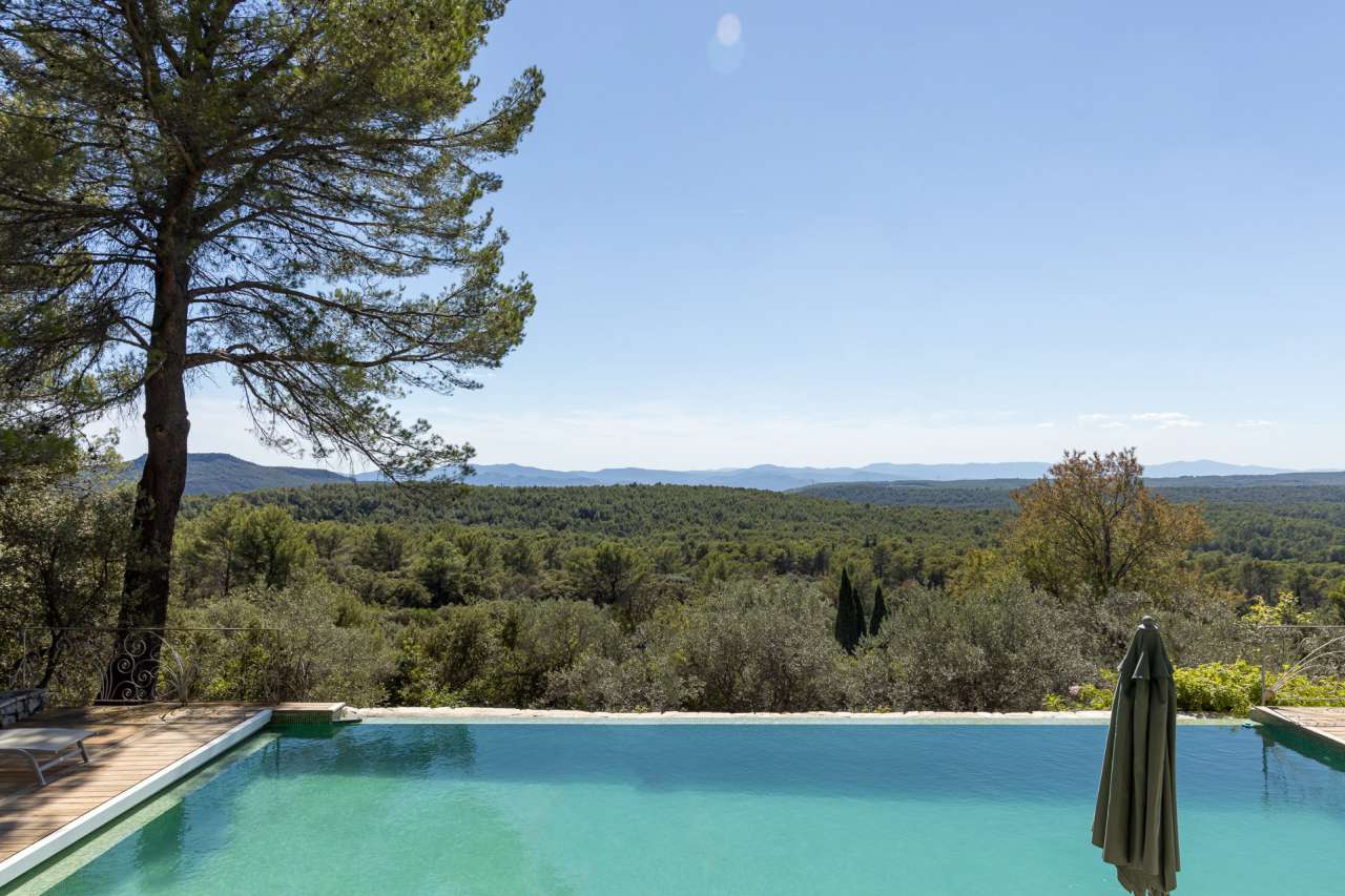 Surrounded by 26.5 acres of glorious land with amazing pool and gardens, is