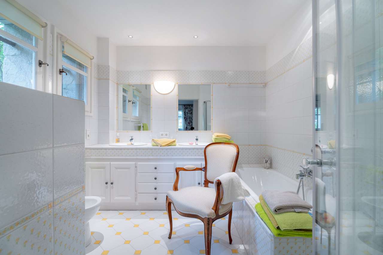 Nestling in over an acre of glorious landscaped gardens with expansive pool