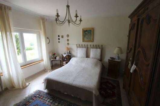 Nestling in nearly 3 acres of glorious landscaped gardens with fruit trees,