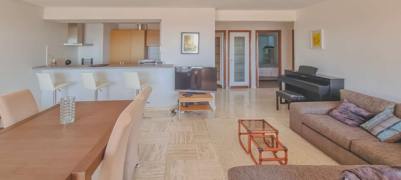 A bright, open plan apartment on the sea-front in a highly sought after res