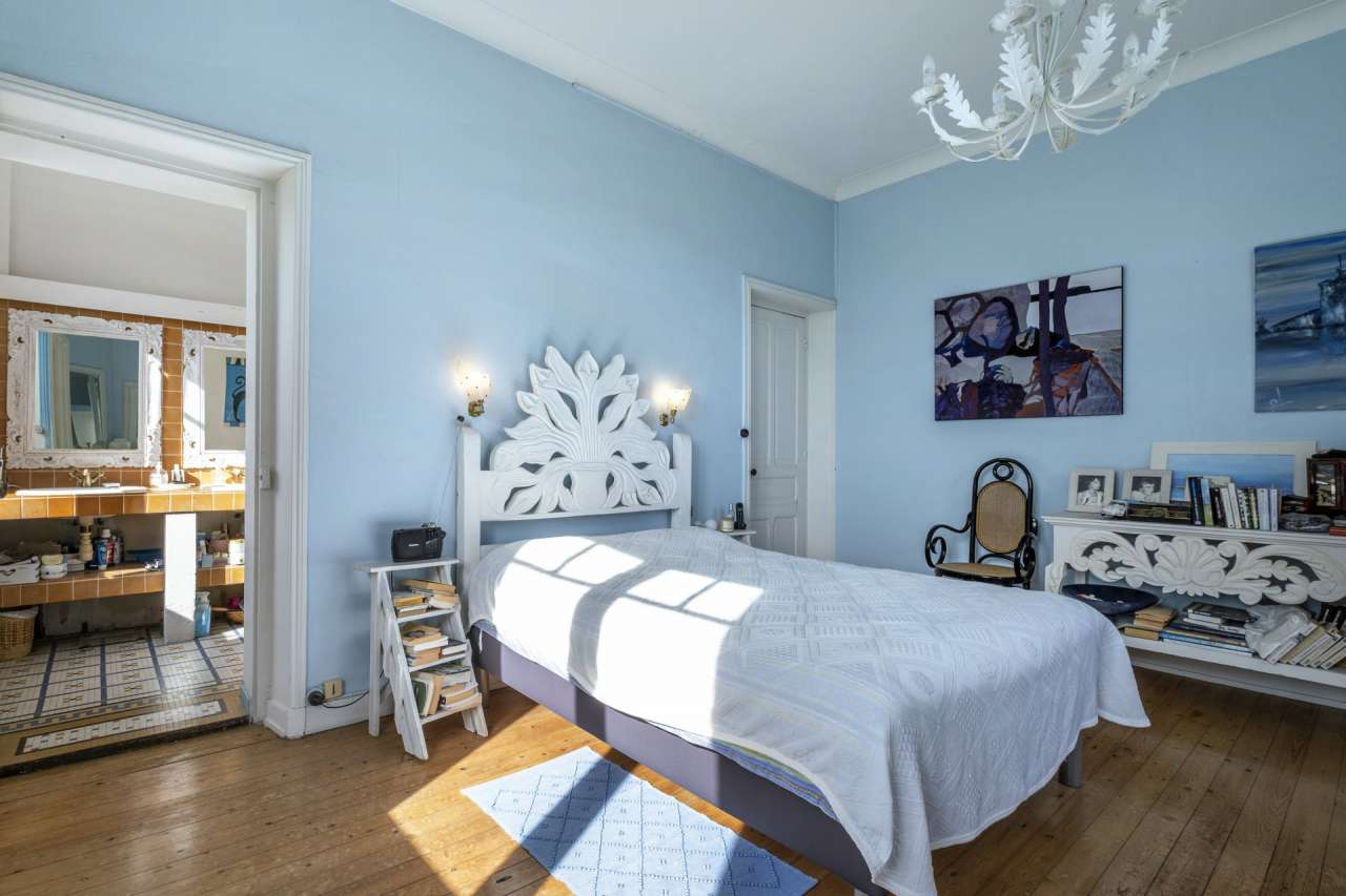 Nestling in an acre of beautiful landscaped gardens with pool, is this supe