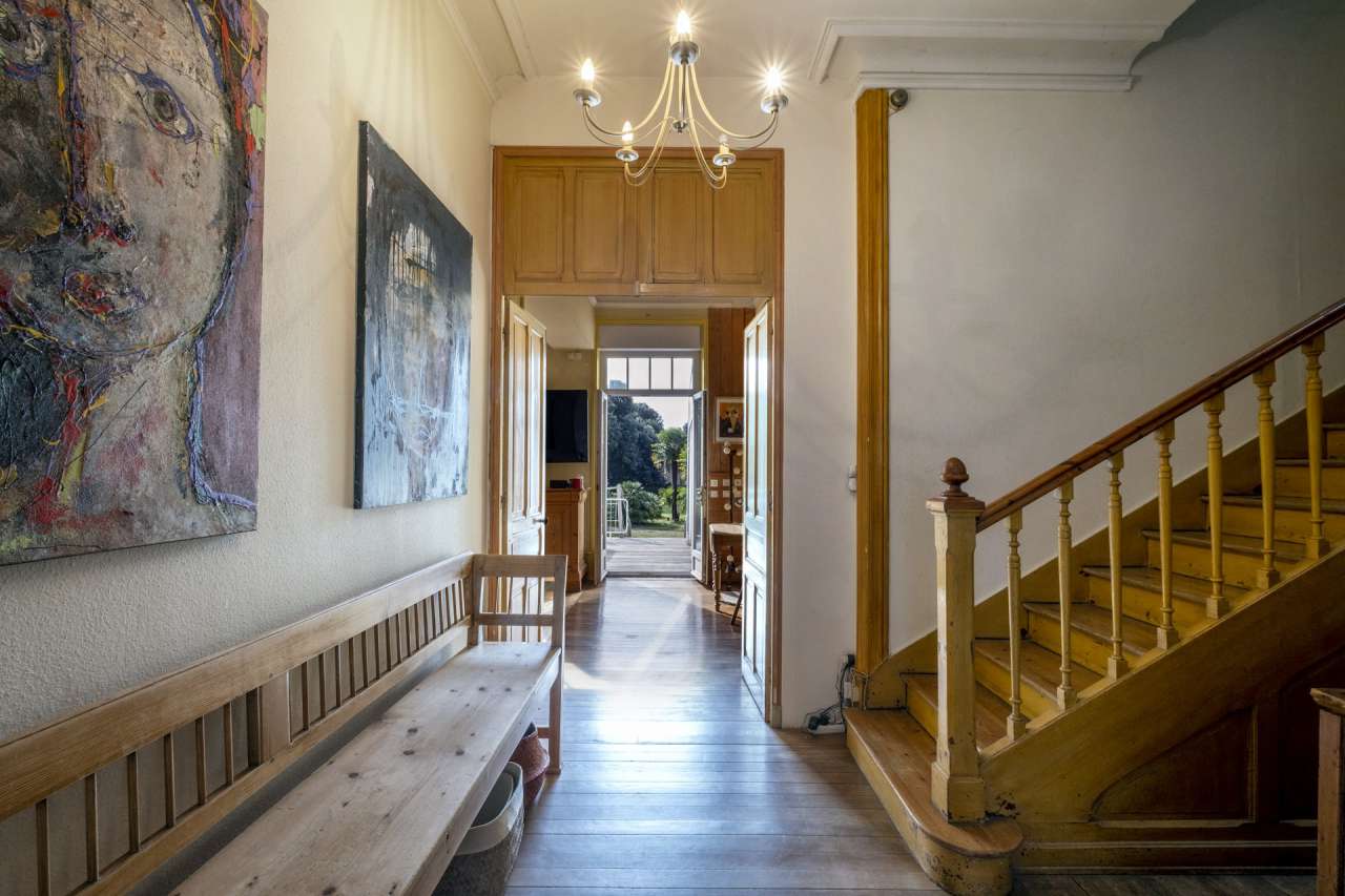 Nestling in an acre of beautiful landscaped gardens with pool, is this supe