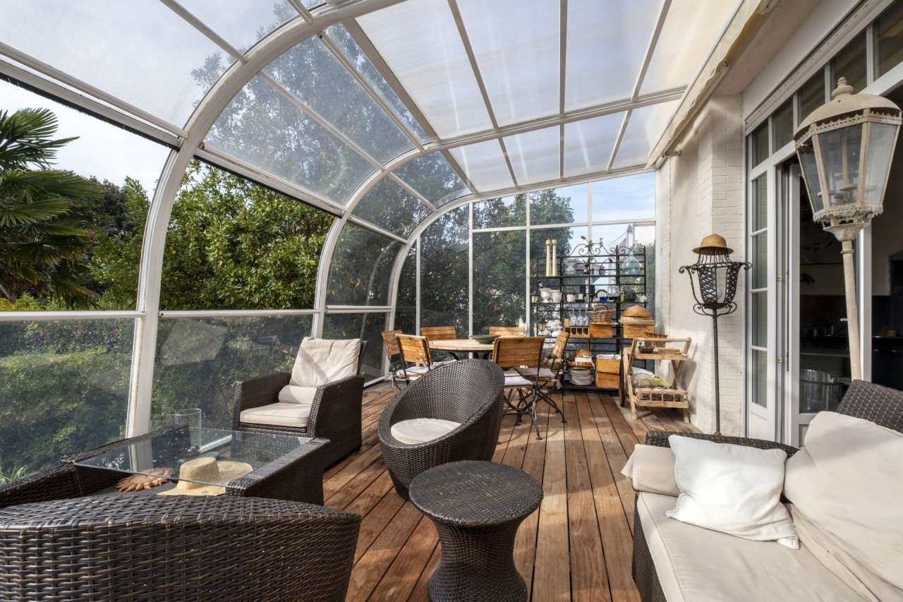 Nestling in an acre of beautiful landscaped gardens with pool, is this supe