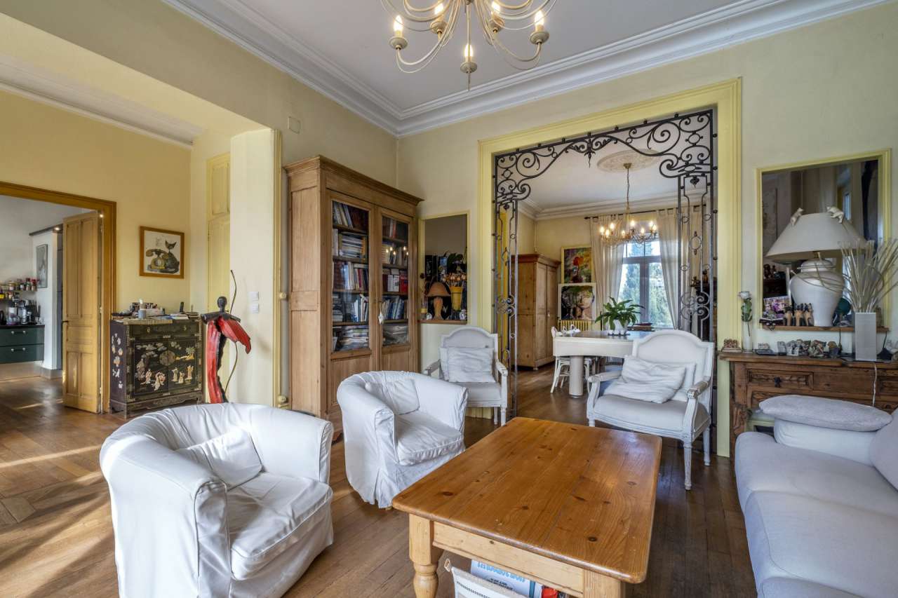 Nestling in an acre of beautiful landscaped gardens with pool, is this supe