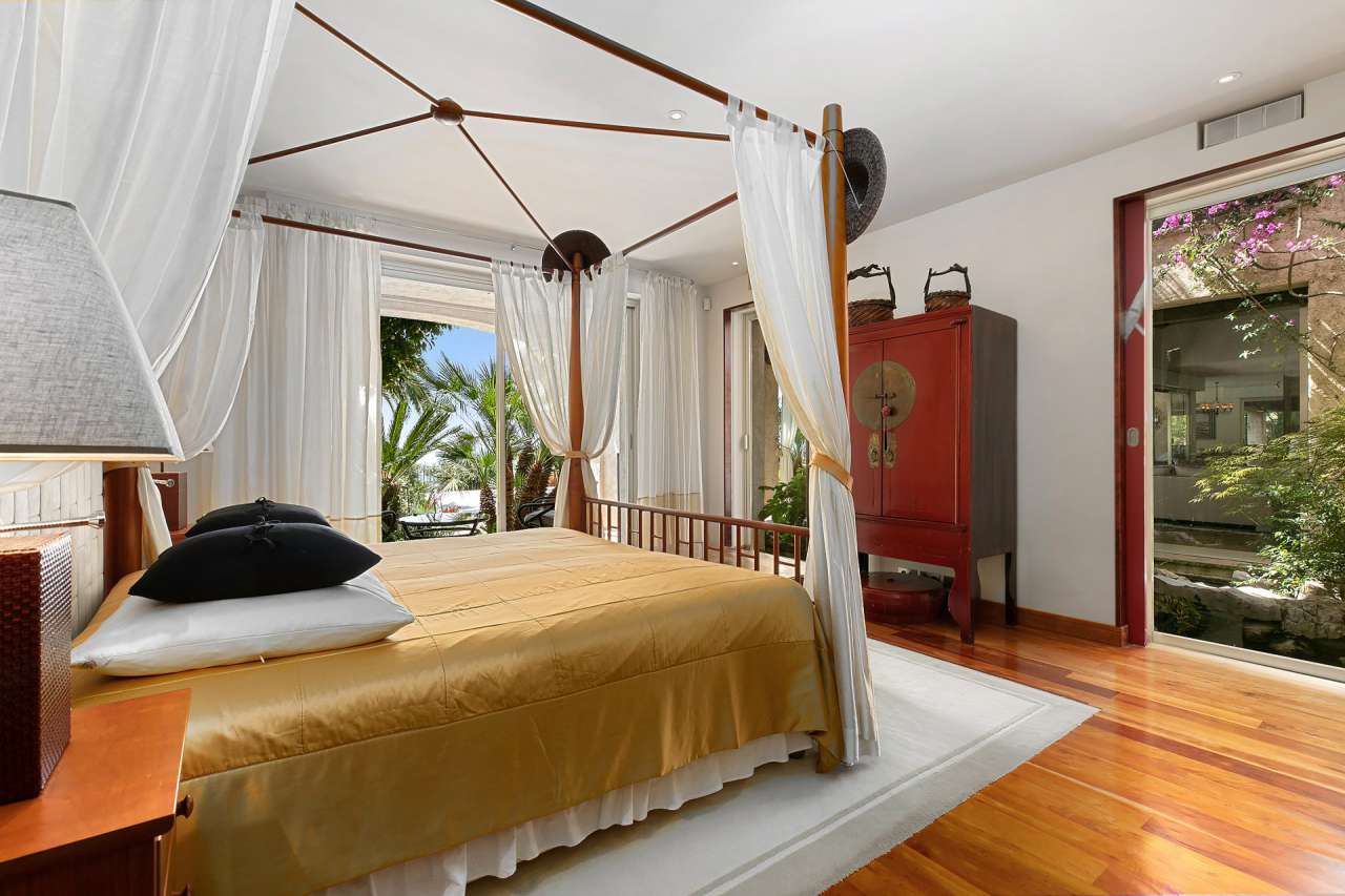 Surrounded by 17,720m2 of mature gardens and ideally located in one of the