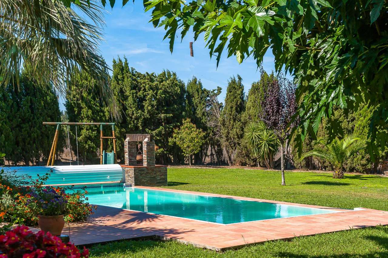 Lovely 4 bedroom home set within lush landscaped gardens of 2,376m2 with a